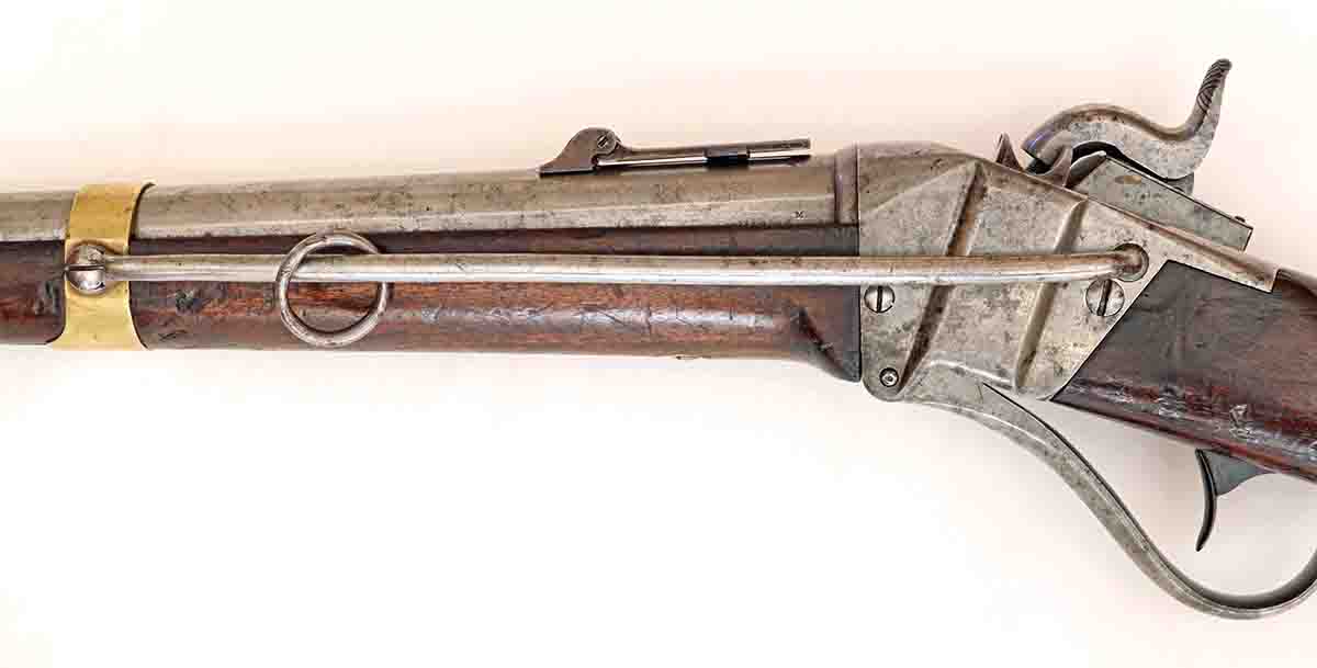 The nine-inch sling bar and ring for attachment of the wide carbine sling. The bar, ring, and sling were intended to prevent the soldier from dropping his carbine while on horseback. The bar was later shortened to prevent the carbine from flipping muzzle-up while bouncing around on horseback.